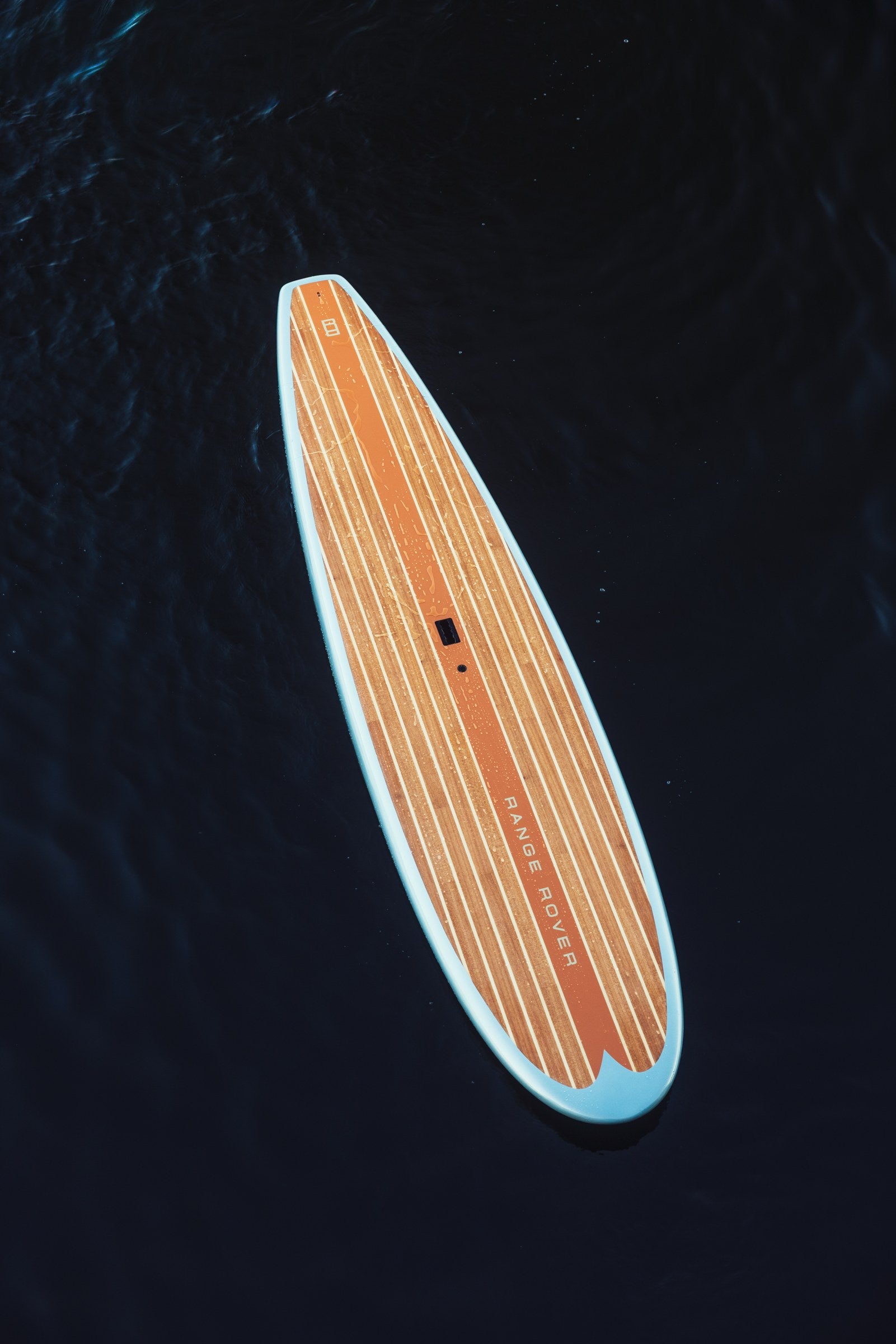 Custom Range Rover rigid paddleboard on the water